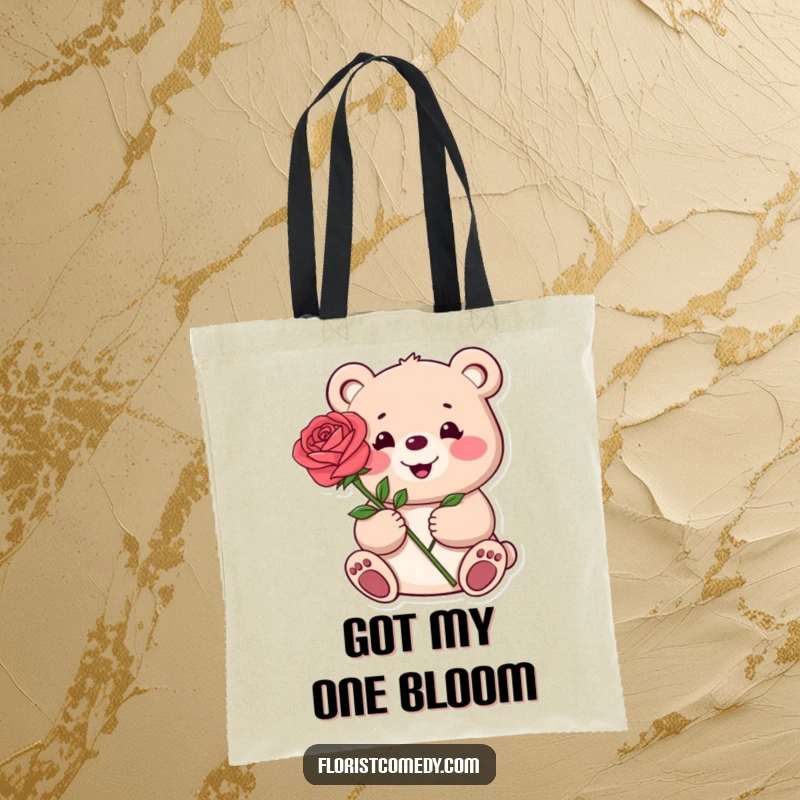 Funny tote bag featuring a happy bear presenting a single beautiful rose, ideal for carrying essentials with romantic flair.