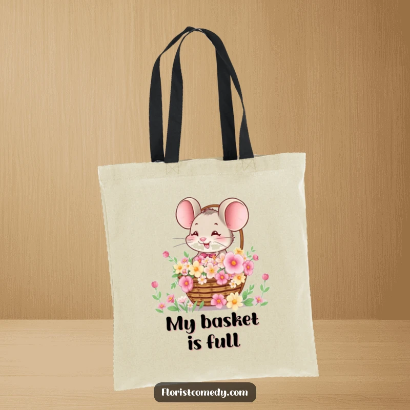 Funny tote bag featuring a giggling mouse presenting a basket packed with vibrant flowers, perfect for shopping or daily use.